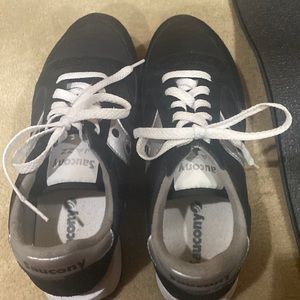 Black and silver casual tennis shoe.